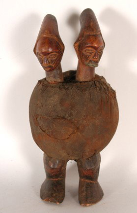 Teke Tribe Double Head Fetish.: Carved wood and fabric. Chipped right toes, otherwise good condition. 14" x 6" x 6". Est. $100-200. Ship: $45. This Tekefetish figure which features two finely carved figures atop a wrapped fabric bun