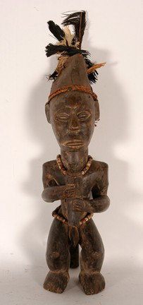 Ba Kongo tribe reliquary figure: Carved wood, mixed media. Good condition. 18" x 5" x 5". Est. $100-200. Ship: $35. This is a rare 'cross cultural' Ba Kongo reliquary figure. Neighbors of the Fang tribes (who are noted for their reli