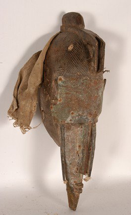 Mali Warka Mask with Copper Sheets.: Carved wood, copper, fabric. Fair condition. 17" x 6" x 5.5". Est. $100-200. Ship: $35. The Warka (also known as Marka) occupy the Northern region of Bambara territory. Although they speak different l