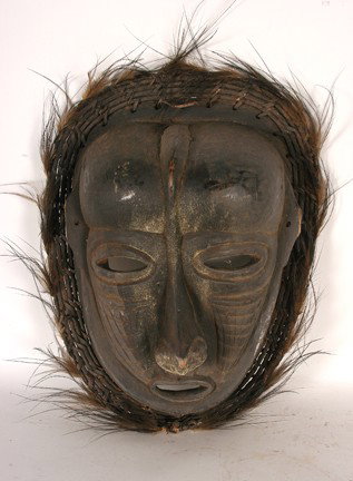 African Mask.: Carved wood. Feathers. Fair condition. 18" x 13" x 5.5". Est. $100-200. Ship: $45.