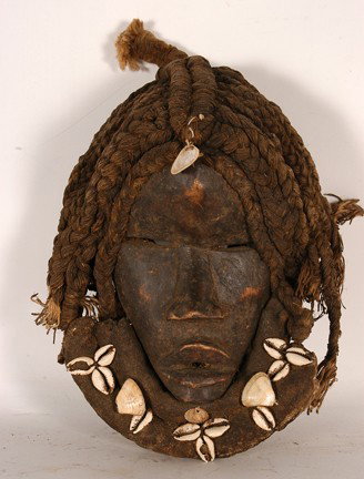 Dan Tribe Mask w Dreadlocks & Cowrie Beard.: Carved wood, shells, rope. Fair condition. 13" x 8" x 6". Est. $100-200. Ship: $25.