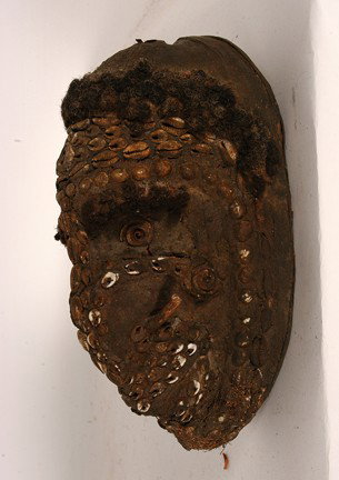 PNG Munduguma Tribe Mask w Human Hair.: Carved coconut, shells, hair. Fair condition. 10.5" x 5" x 5". Est. $100-200. Ship: $25. This type of representation is known as a "Munduguma" or "area spirit" mask. Very rare ethnographic specimen, n