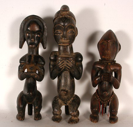 African Figures.: Carved wood and stain. 18" x 5" x 4". Est. $100-200. Ship: $45. African Fang Statue, female figure. Fang Reliquary guardian figure in a seated position from Gabon, West Africa. The Fang tribe is well 