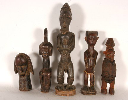 African Figures.: Carved wood, fabric. Good condition. 20" x 4" x 5" average. Est. $100-200. Ship: $55. Kwere tribe "Ancestral figure with bead belt". African fetish-Yaka tribe - A small Yaka fetish with "bilongo" boun