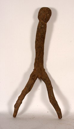Bateba Fetish Figure - Lobi tribe.: Carved root. Good condition. 29" x 13". Est. $100-200. Ship: $65. This fetish figure from the Lobi of Burkina Faso is primitively done, well-encrusted piece mounted on a pair stands. The Lobi do not w