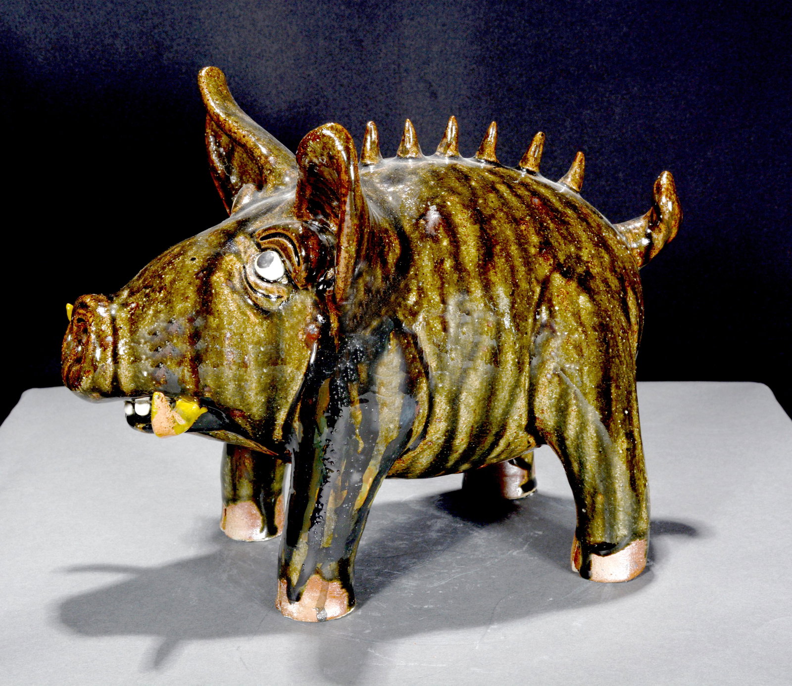 Clete Meaders, Jr. Brown Tusk Spiney Back Hog.: Clete Meaders, Jr. Brown Tusk Spiney Back Hog. 2002. Signed and dated. Mint condition. 9" h x 12" long. Est. $200-300. Ship: $85