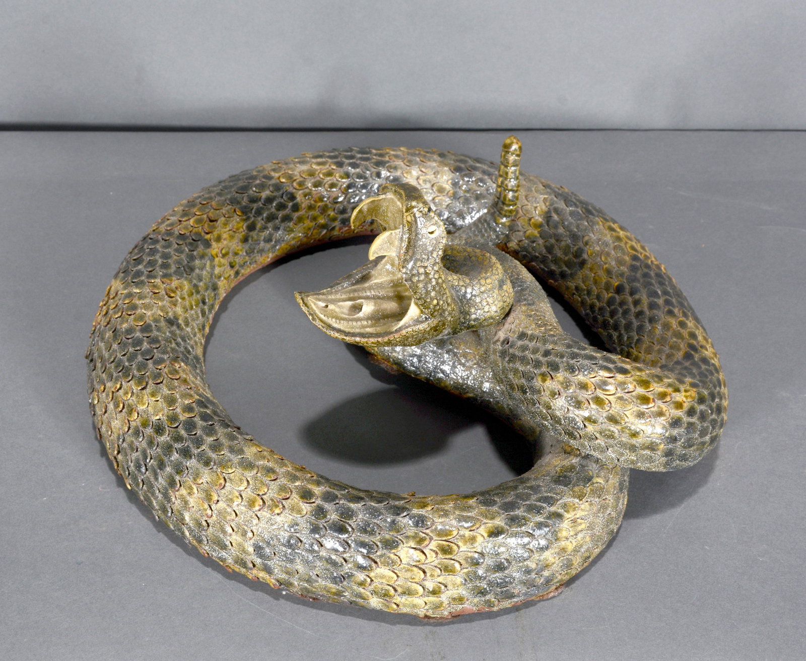 Michael & Melvin Crocker. Open Mouth Rattlesnake.: Michael and Melvin Crocker. Open Mouth Coiled Rattlesnake. 1994. Signed and dated. Repair to fangs and rattle, otherwise good condition. 12.5" x 5.5". Est. $600-900. Ship: $125