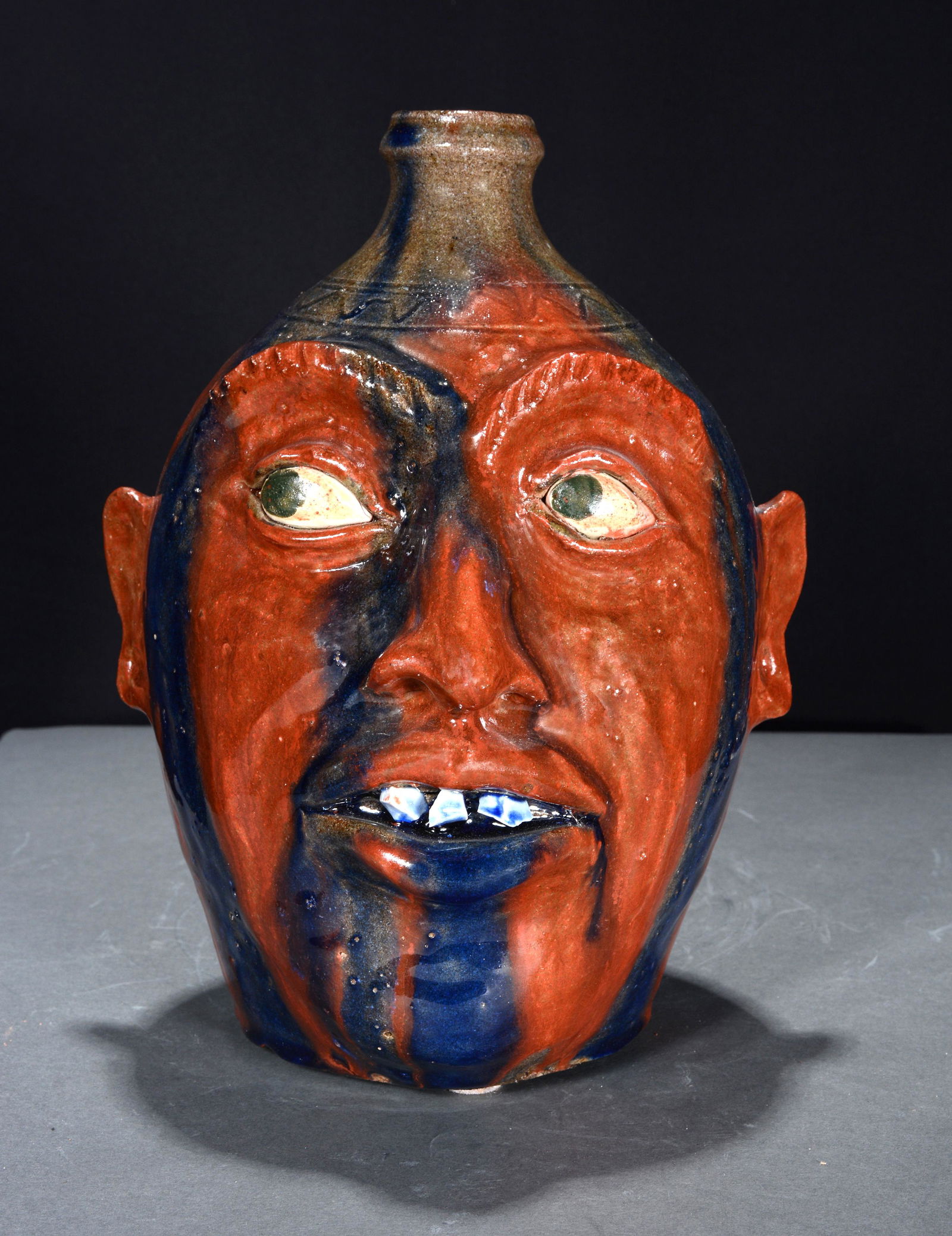 Clint Alderman. Red Face Jug with Blue Glass Drips. (1 of 5)