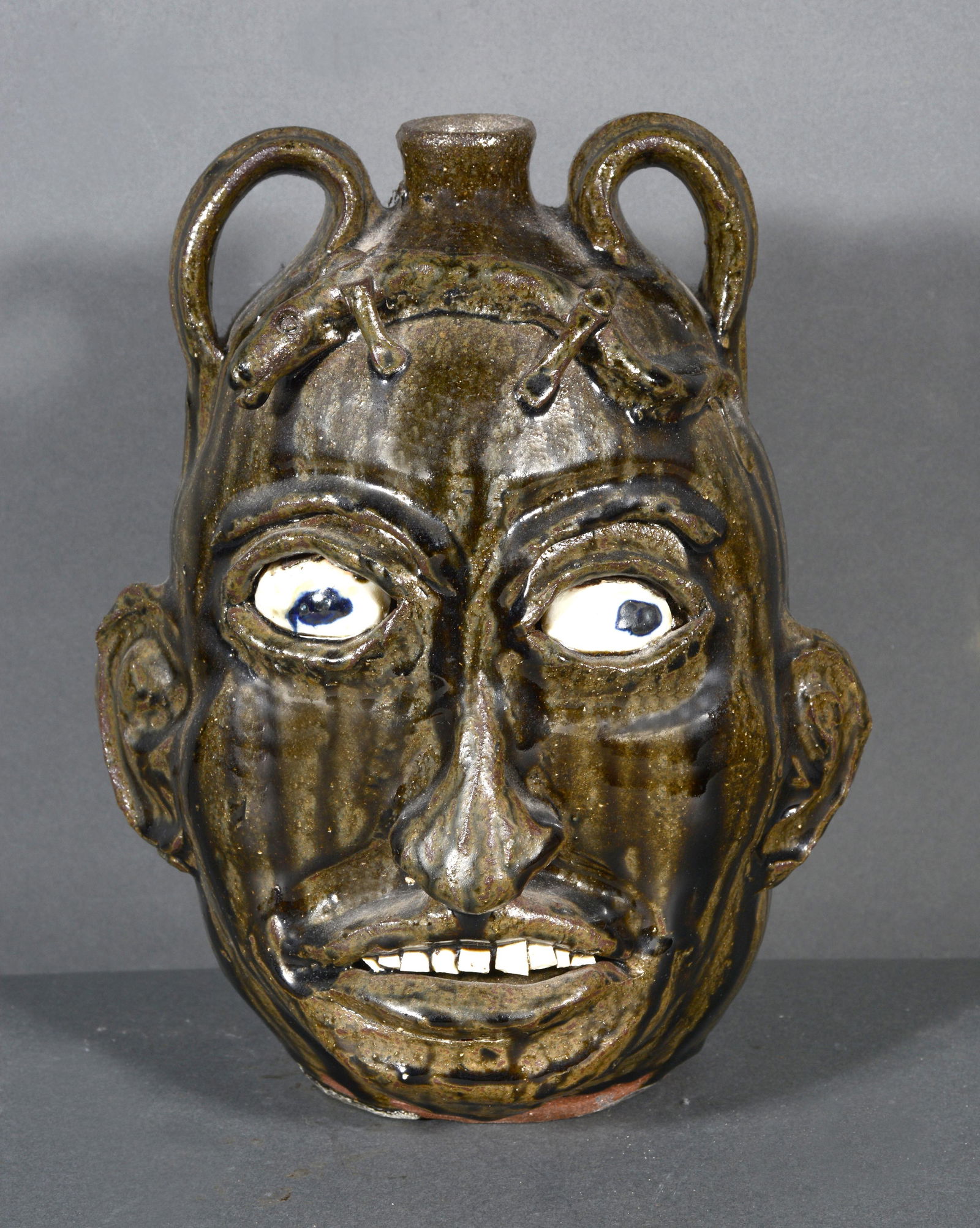 Chester Hewell. Tobacco-Spit Face Jug With Lizard. (1 of 4)
