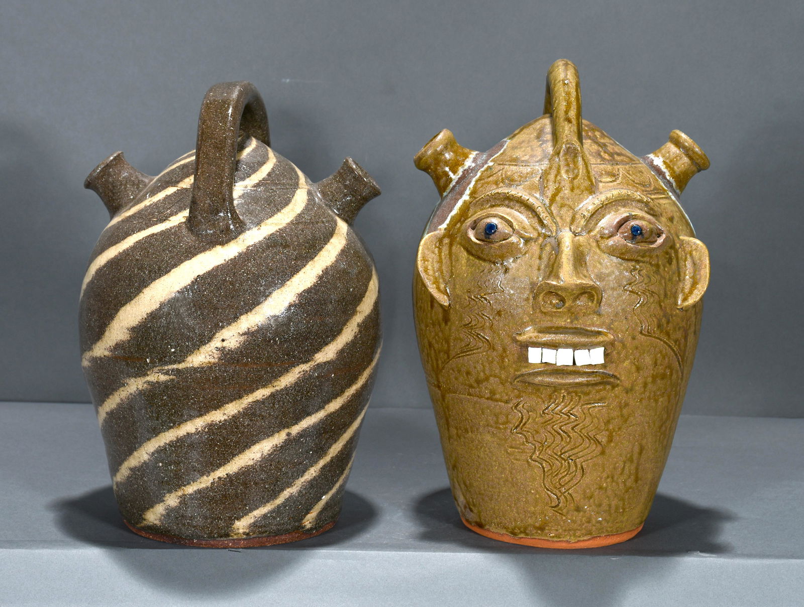 Walter Fleming. Monkey Spout Face Jug & Swirl Jug. (1 of 4)