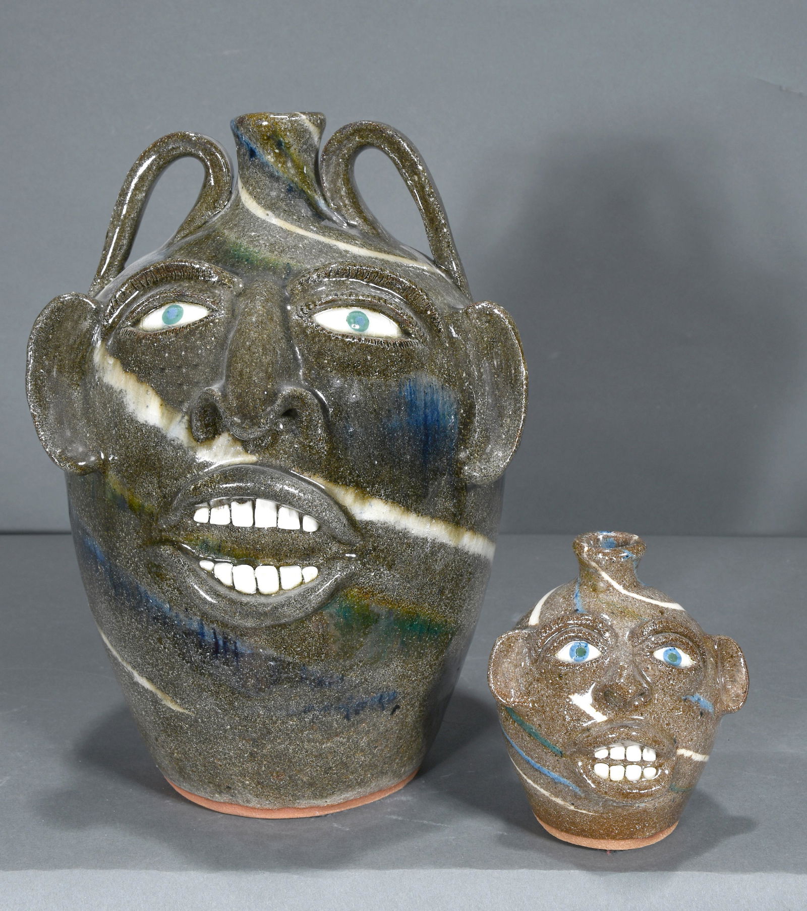 Joe Reinhardt. 4 Color Swirl Large Face & Mini Face Jugs. (1 of 4)