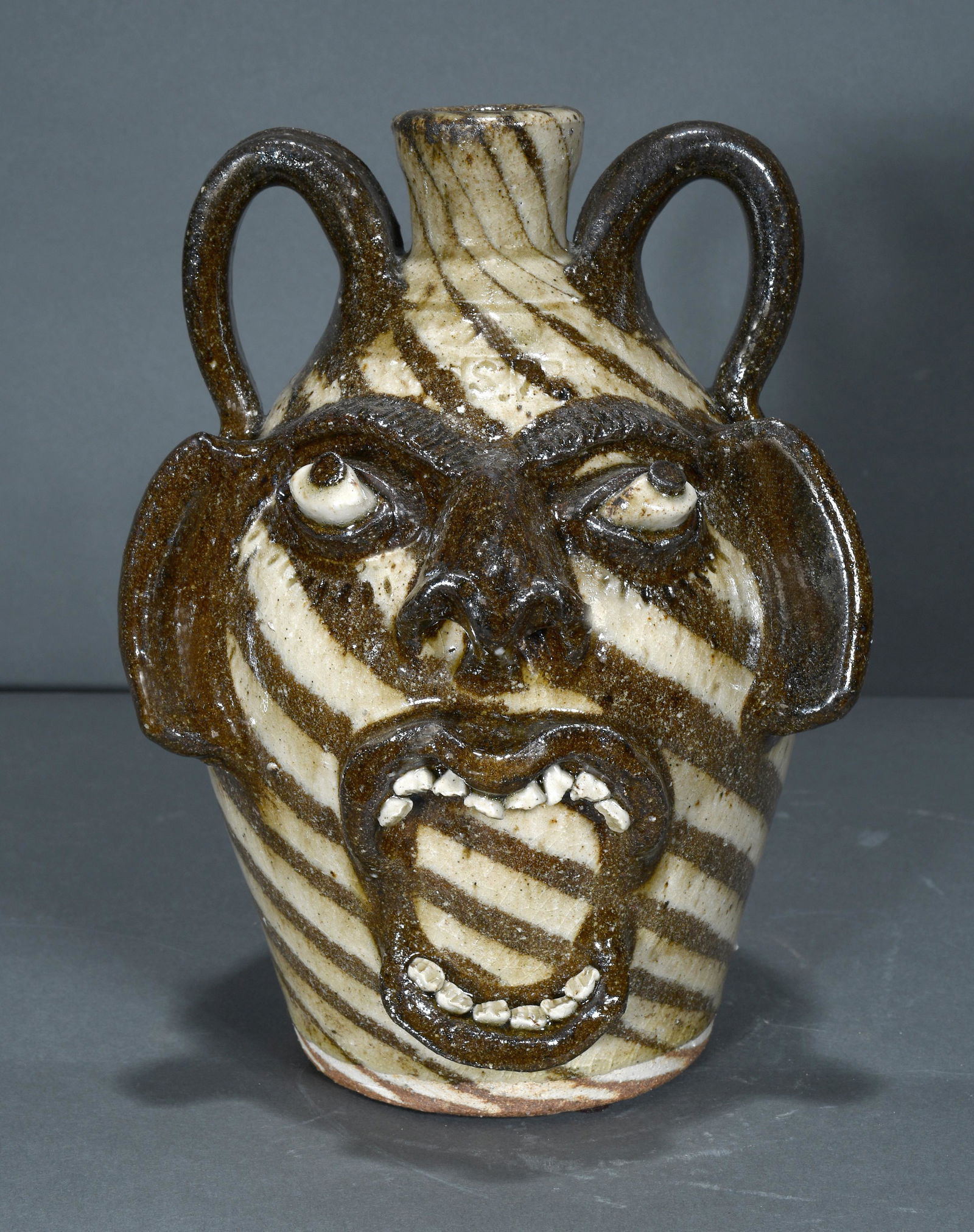 Steve Abee. 2 Color Swirl Dark Screaming Face Jug. (1 of 4)