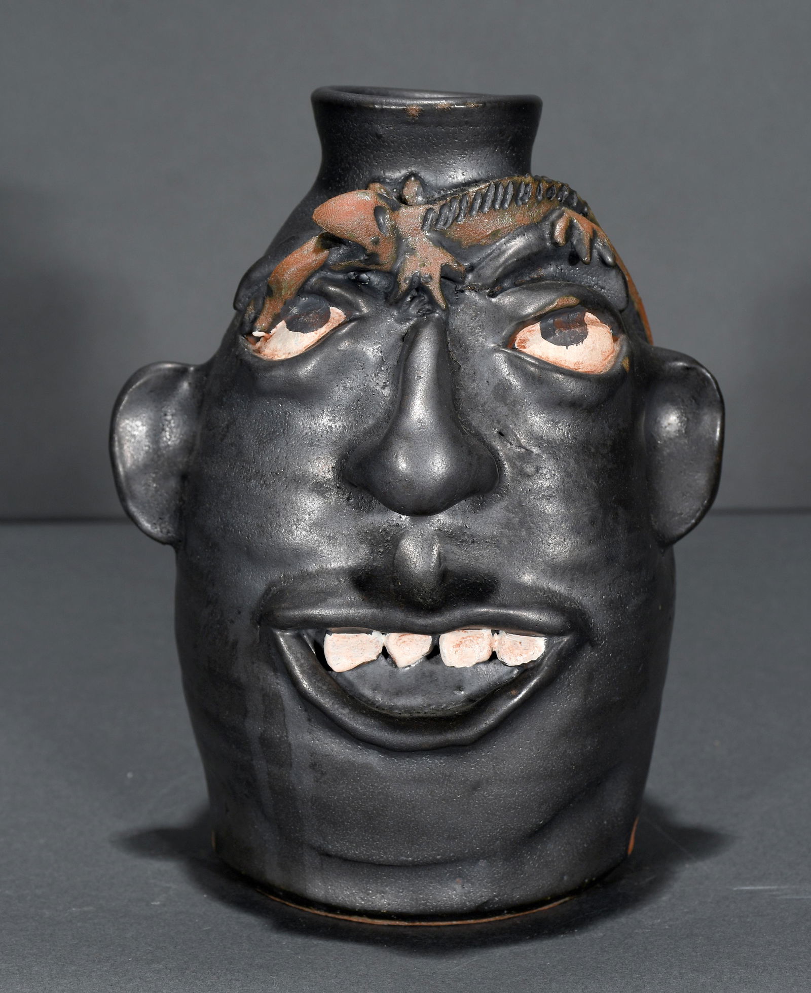 Kim Black. Metallic Black Glazed Face Jug. (1 of 3)