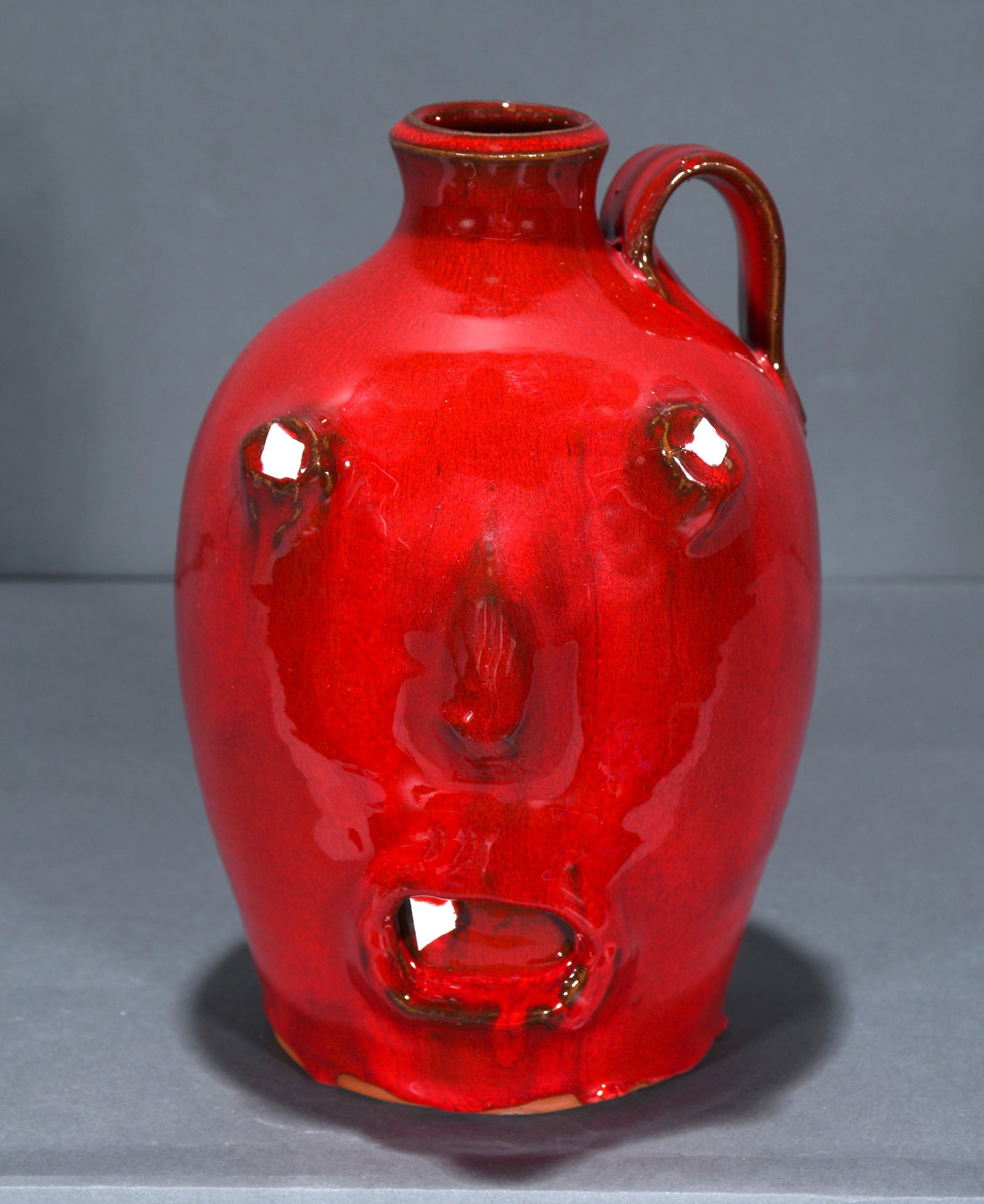 J. Owens. Ruby Red Ghost Face Jug. (1 of 3)