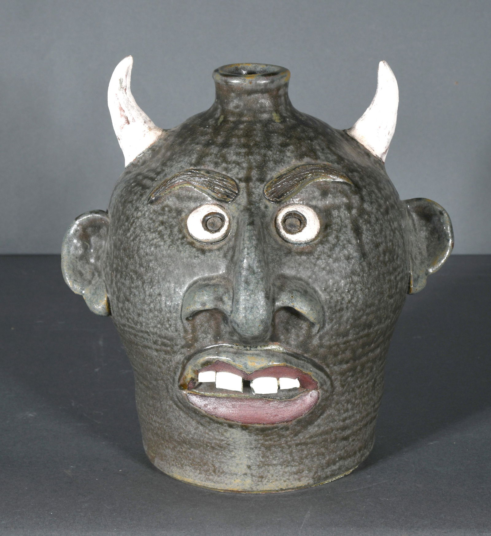 Tom Touchstone. Sly - Devil Face Jug. (1 of 3)