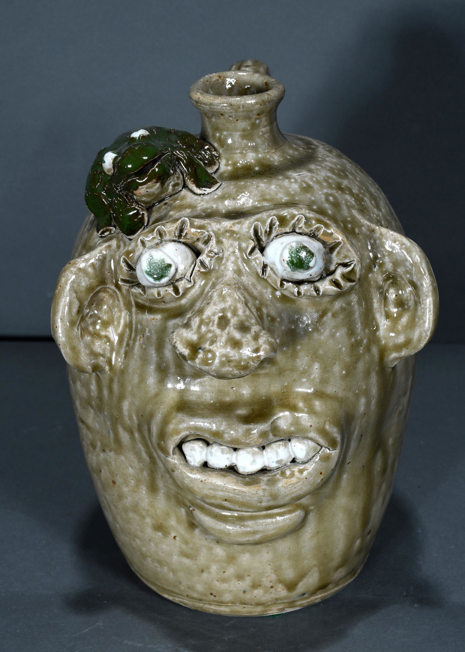 Jerry Brown. Ash Glazed Face Jug with Green Frog. (1 of 3)