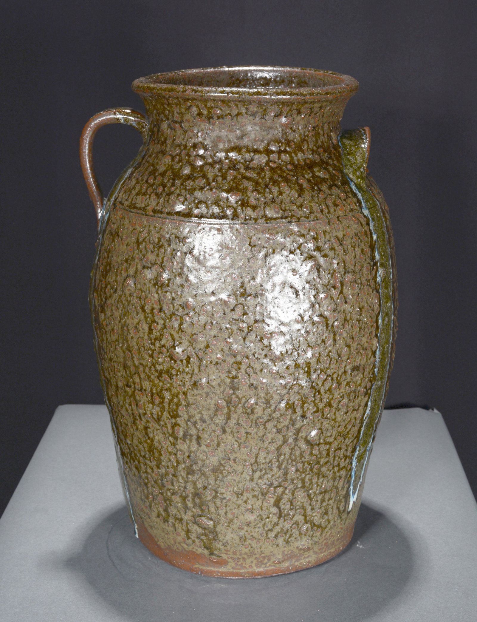 Michael Crocker. Four Gallon Retro Crock.: Michael Crocker. Four Gallon Retro Crock. 2002. Signed, dated and with gallon size. Hand-dug clay with glass drips and rocks bulging through glaze. A beautiful old-timey glaze. Mint condition. 16" h. 