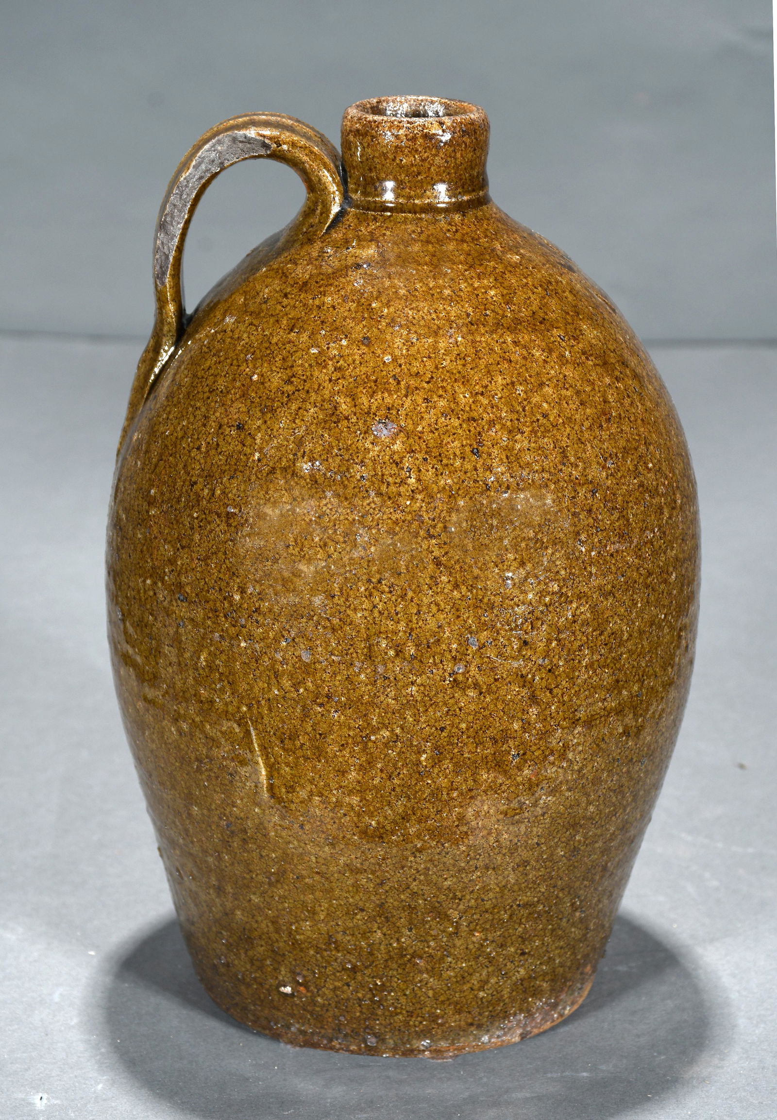 John Goodman. One Gallon Whisky Jug.: John Goodman. One Gallon Whisky Jug. Stamped. c. 1800s. Loss to edge on handle otherwise excellent condition. 10.5" h. Est. $300-500. Ship: $55