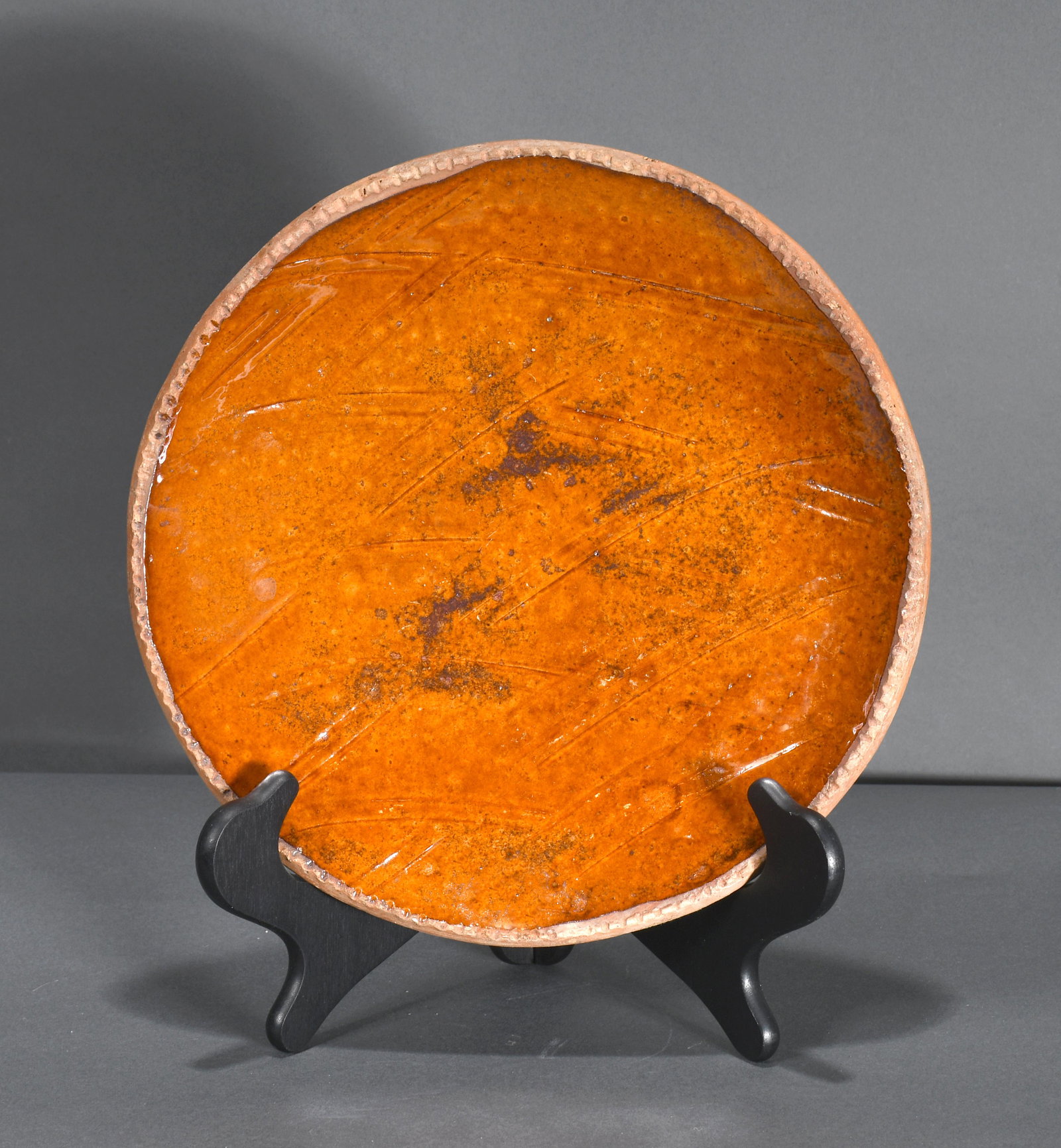 Unknown Maker. Traditional Redware Plate.: Unknown Maker. Traditional Redware Plate. Stamped on bottom. Mint condition. 11" diameter. Est. $200-300. Ship: $45