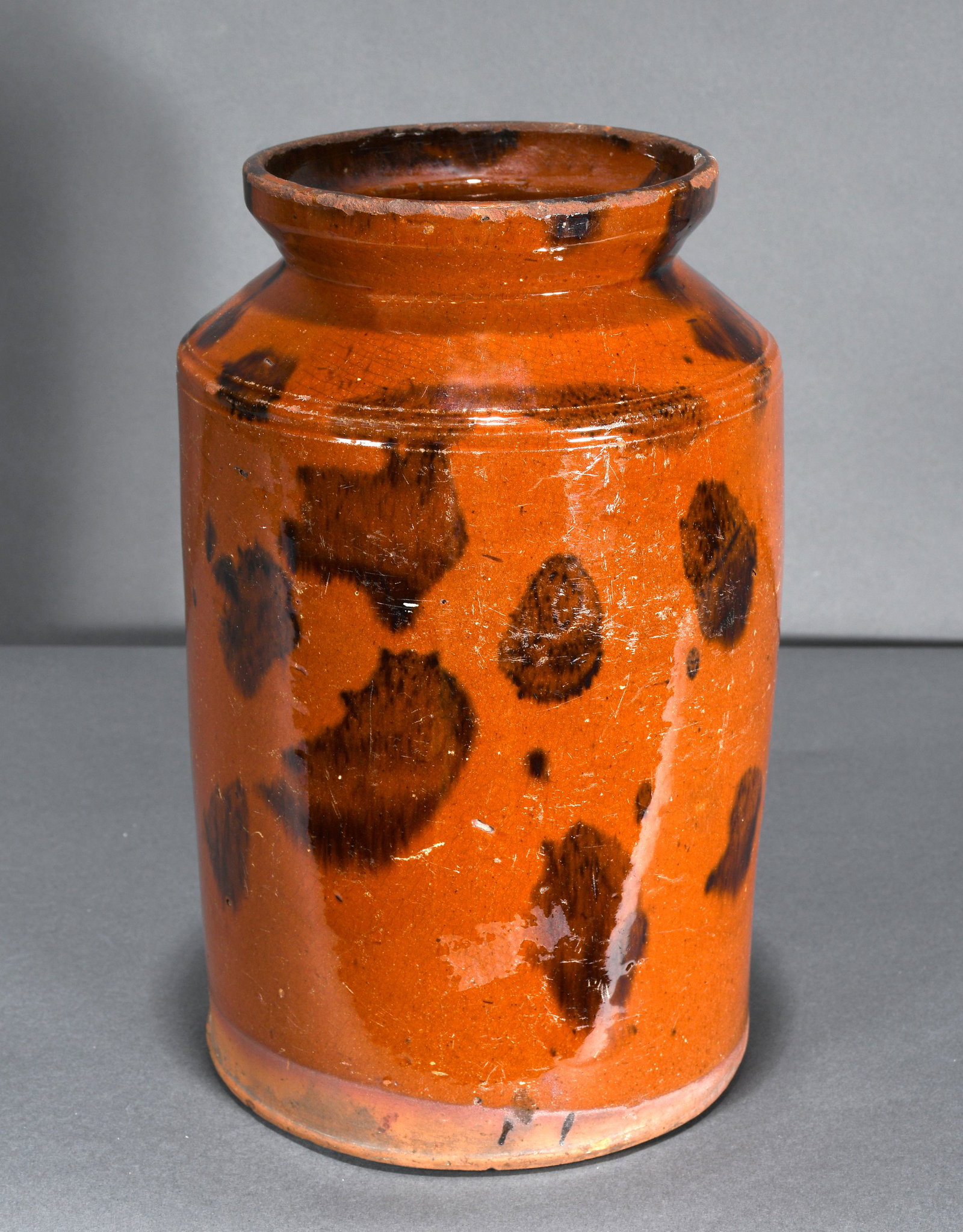 Anonymous. Spotted Redware Jar.: Anonymous. Spotted Redware Jar. Not signed. Traditional glaze. Minor wear on glaze and chiggar bites on rim consistent with age, otherwise great condition. 10.75" h. Est. $1,000-2,000. Ship: $55