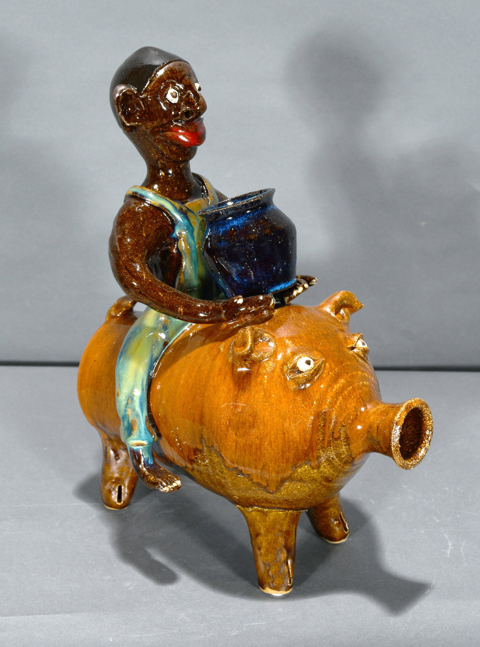Marvin Bailey. Potter Riding a Pig.: Marvin Bailey. Potter Riding a Pig. Signed. Mint condition. 13.5" h. Est. $200-300. Ship: $85