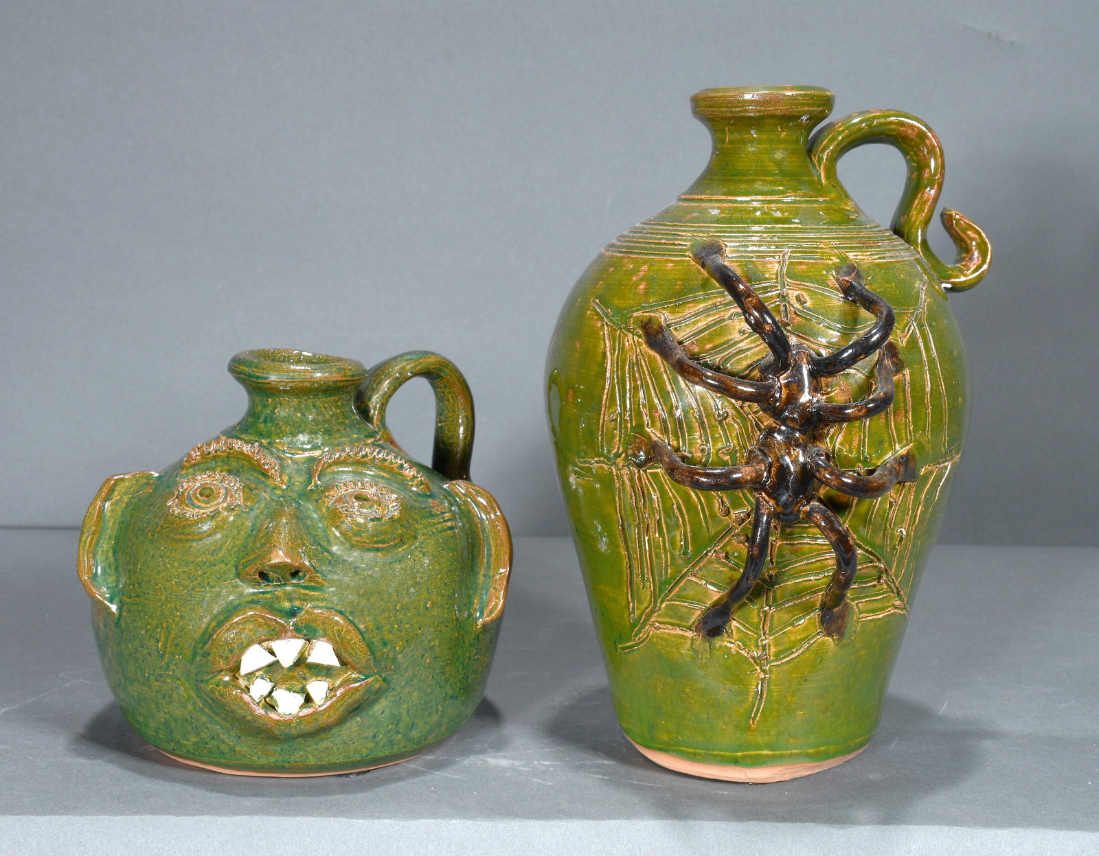 Bobby Ferguson. Spider Jug and Buggy Face Jug. (1 of 2)