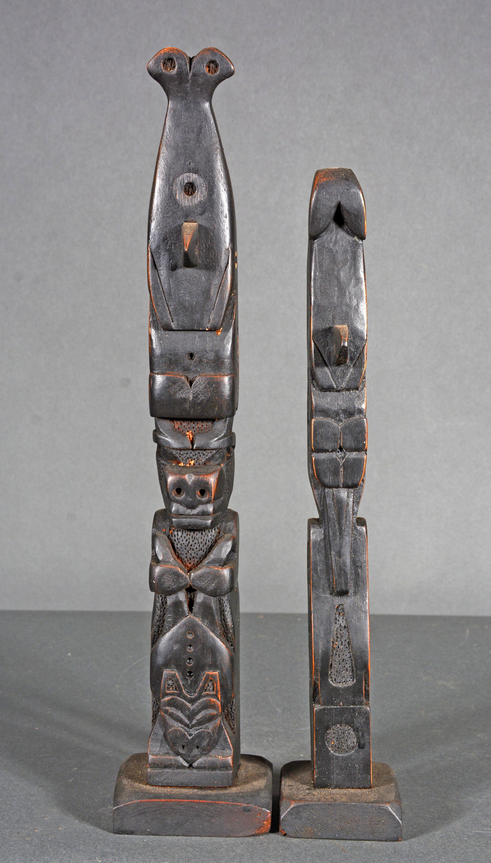 Simons. Orca With Bear Holding Salmon & Orca with Crane Totems.: Simons. Orca With Bear Holding Salmon & Orca with Crane Totems. Signed. Carved and dark stained wood. Minor wear, otherwise excellent condition. Tallest is 15" h. Est. $300-500. Ship: $45