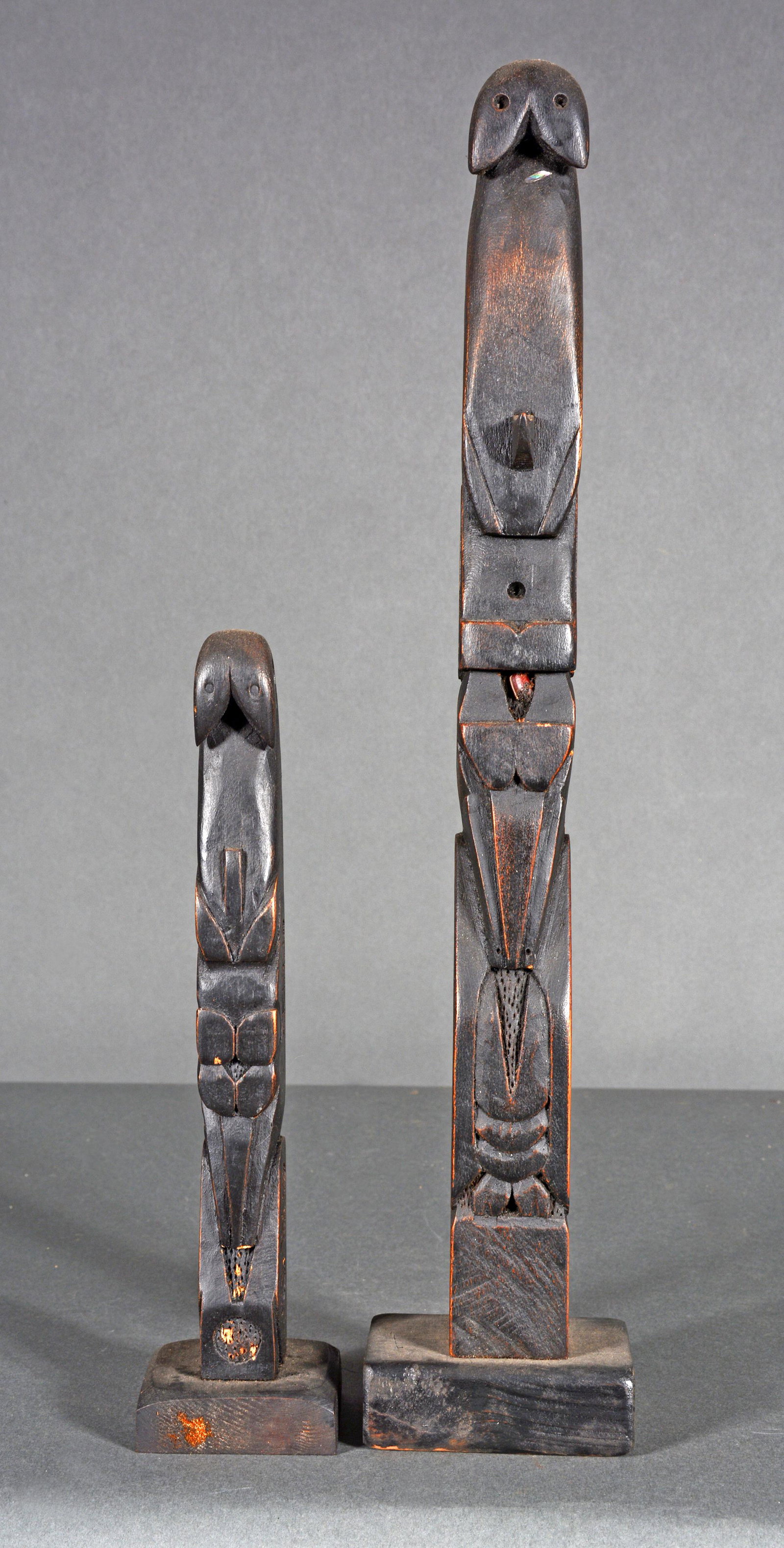 Simons. Large and Small Orca With Cranes Totems.: Simons. Large and Small Orca With Cranes Totems. Signed. Carved and dark stained wood. Minor wear, otherwise excellent condition. Tallest is 16" h. Est. $300-500. Ship: $45