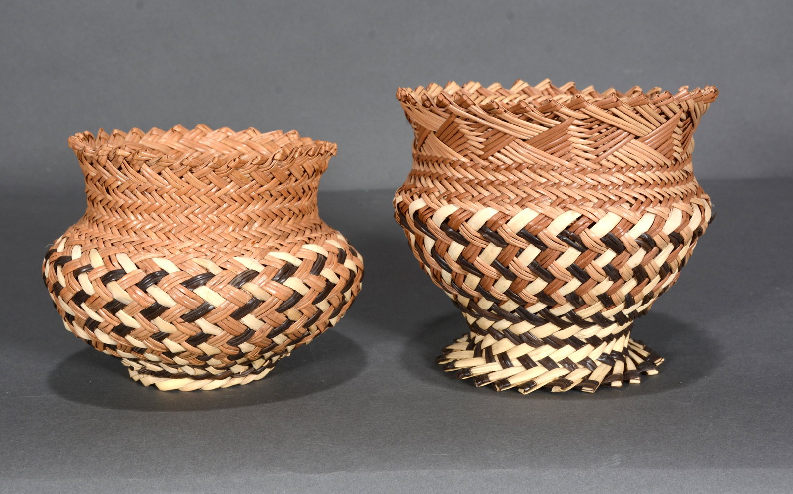 Pair of Mini Straw Basket Vases.: Unknown Maker. Pair of Mini Straw Basket Vases. Straw. Excellent condition. 4.5" x 5". Provenance: Barbara & Robert Hunter Collection. Est. $100-200. Ship: $35