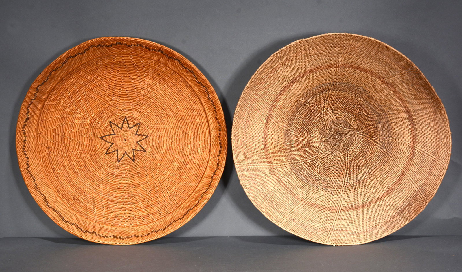 Pair of Wheat Shaft Baskets.: Anonymous. Pair of Wheat Shaft Baskets. Not signed or dated. Woven natural materials. Excellent condition. Average size is 23.5" x 3". Provenance: Barbara & Robert Hunter Collection. Est. $200-300. Sh