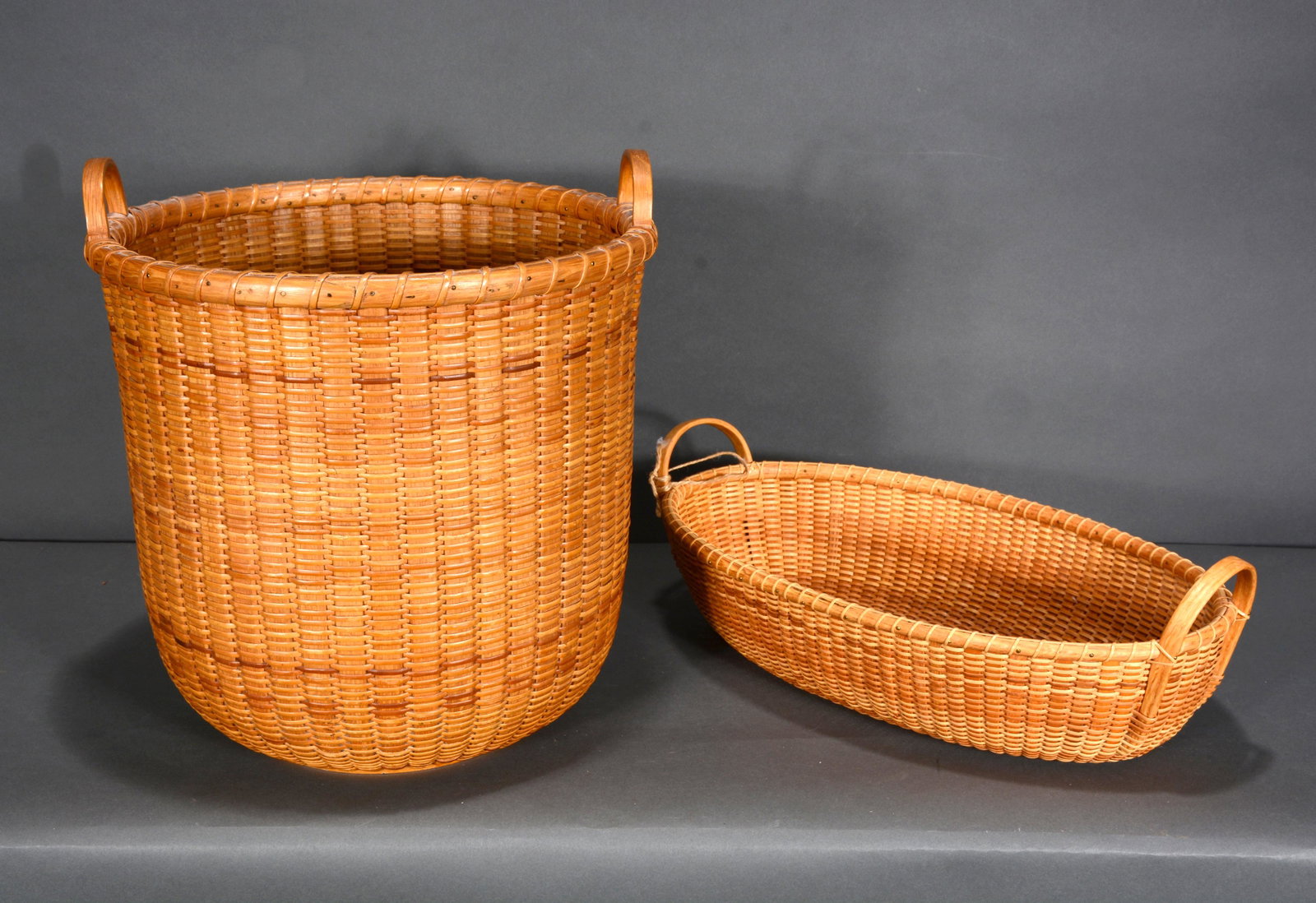 H.E.H. and S. Gibbs. Pair of NE Baskets.: H.E.H. and S. Gibbs. Pair of NE Baskets. 1995. Oak with wooden base. Excellent condition. 13" x 12". Provenance: Barbara & Robert Hunter Collection. Est. $200-300. Ship: $55