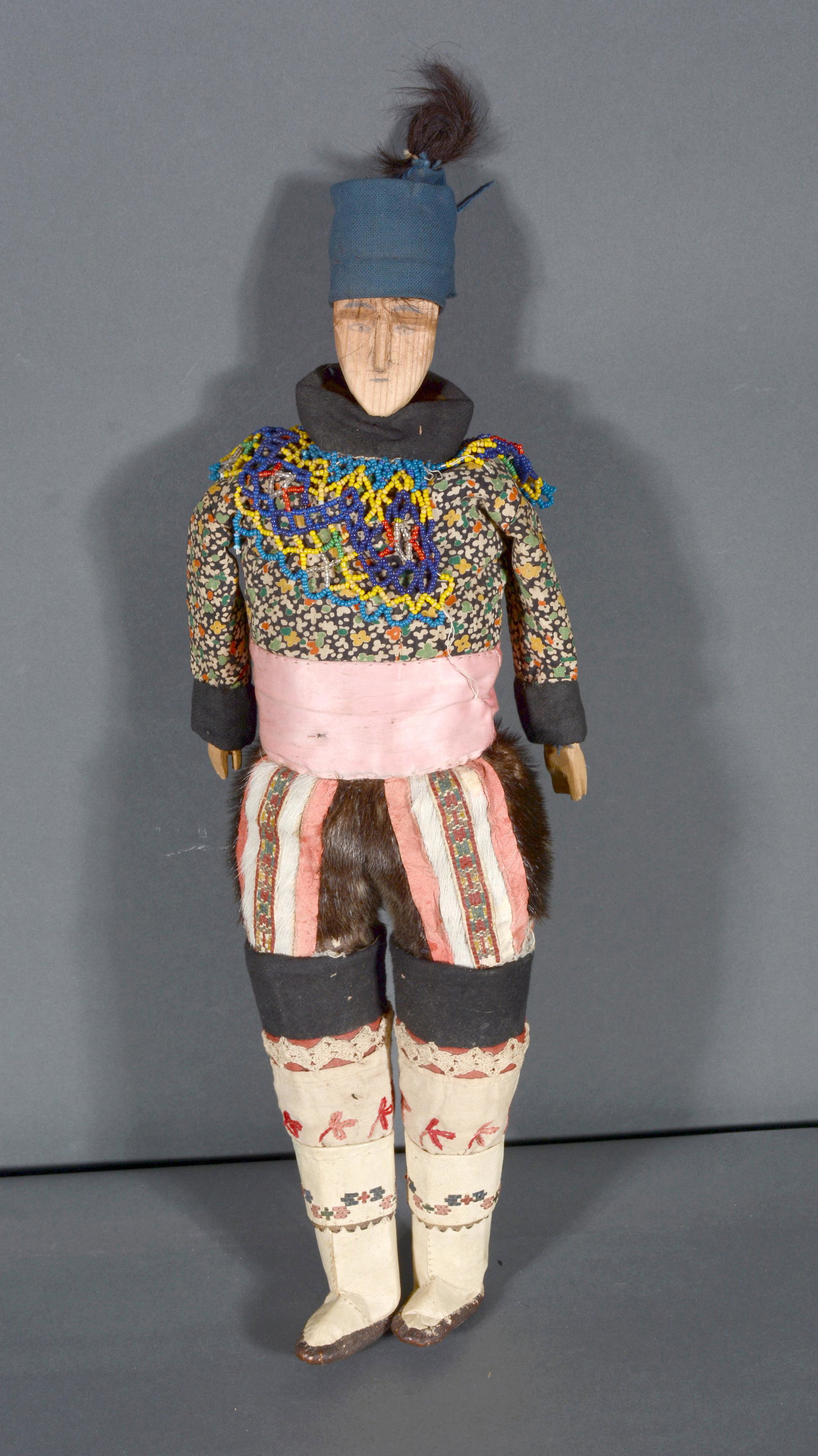 Doll With Traditional Inuit Clothing.: Anonymous. Doll with Traditional Inuit Clothing. Not signed. Wooden figure with traditional clothing. Great condition. 19" h. Est. $300-500. Ship: $45