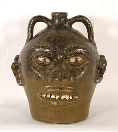 Lanier Meaders. Double Rock Tooth Face Jug.: Lanier Meaders. Double Rock Tooth Face Jug. c. 1970’s. One face has perfect rock teeth, other side missing two quartz teeth in front. It looks like the teeth were lost in firing, otherwise jug is mi