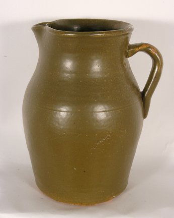 Cheever Meaders (attributed). Large Pitcher.: Cheever Meaders (attributed). Large Pitcher. Not signed. Matt-green glaze. Handle is typical of Cheever’s work. Mint condition. 10”h. Est. $100-300. Ship: $45