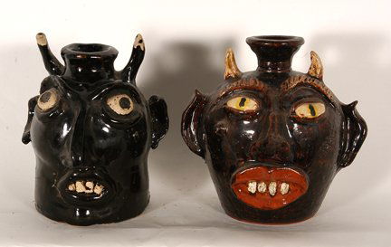 Albert Hodge & Unknown. Pair of Devil Jugs.: Albert Hodge and Unknown. Pair of Devil Jugs. Dark glaze. Mint condition. 6”h. Est. $100-150. Ship: $50