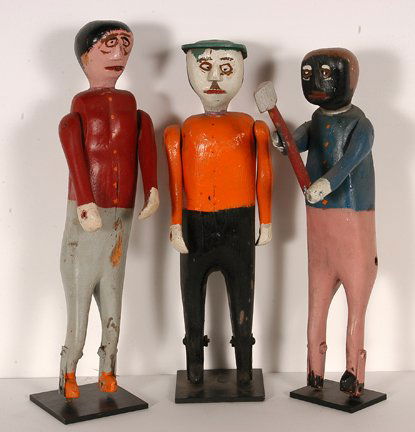 Three Male Figures.: Three Male Figures. Carved and painted wood with paint and metal fasten to legs and hole wear they may have been attached. These were possibly used at one time on a mechanical attraction. Average size