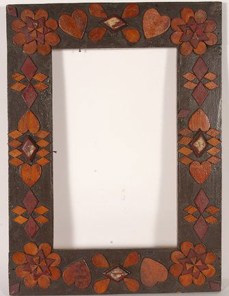 Anonymous. Flower And Heart Frame.: Anonymous. Flower And Heart Frame.Carved and varnished wood with applied decorations. 17” w x 23”. Excellent condition. Prov.: The Leslie Eisenberg Folk Art Gallery, NY. Est. $250-350. Ship: $45