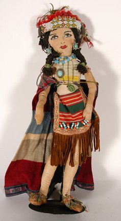 Native American Indian Girl.: Native American Indian Girl. Stuffed fabric, plastic beads and a mix of Indian dress and costumes. Fair condition. 16”h. Provenance: The Leslie Eisenberg Gallery Collection. Est. $100-200. Ship: $25