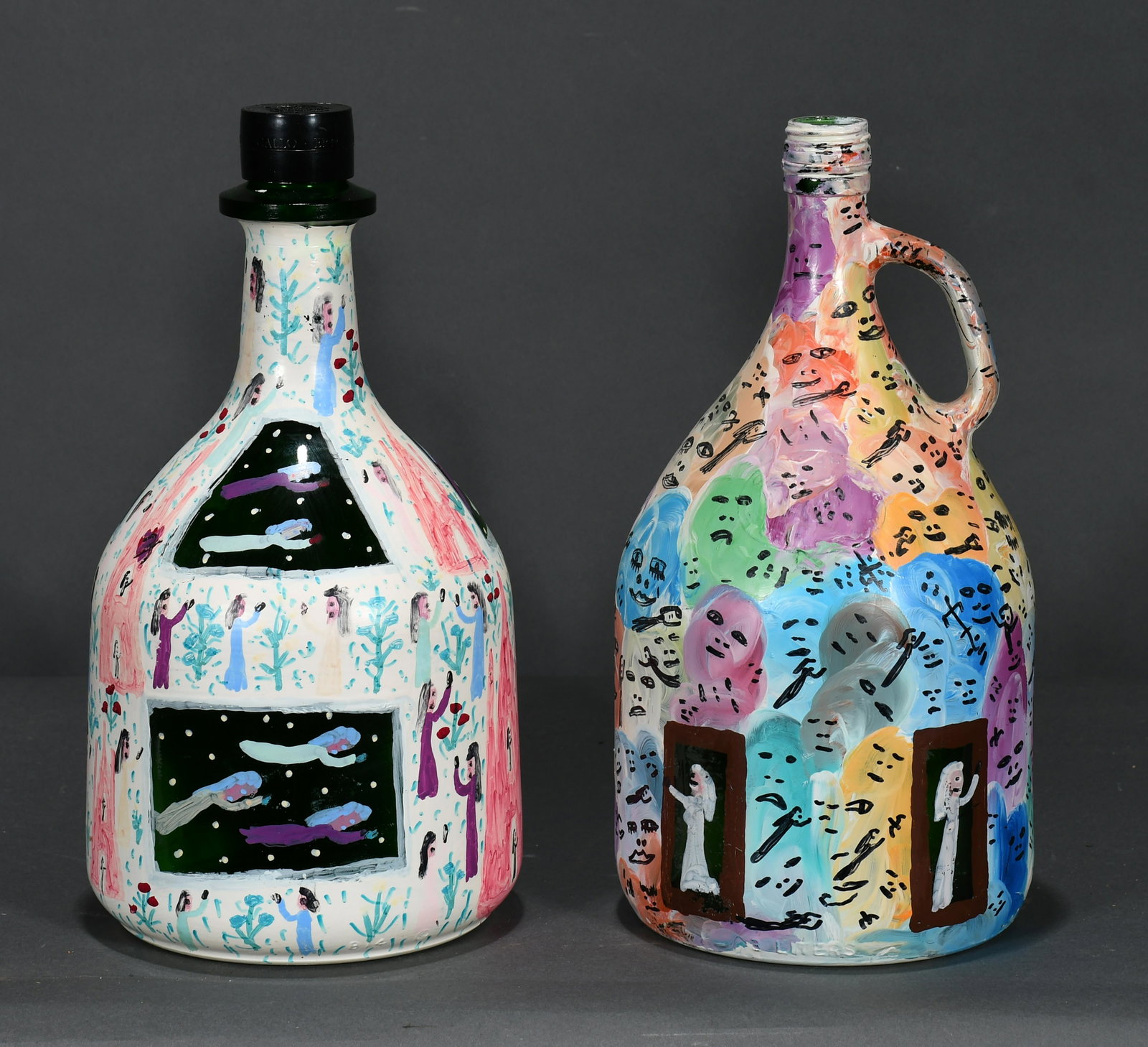 Howard Finster. Pair of Painted Wine Jugs.: Howard Finster. Pair of Painted Wine Jugs. 1992. #24,963 and #24,967. Signed, dated and numbered. Paint on wine glass bottle. Excellent condition. 12.5"h each. Est. $300-500. Ship: $65