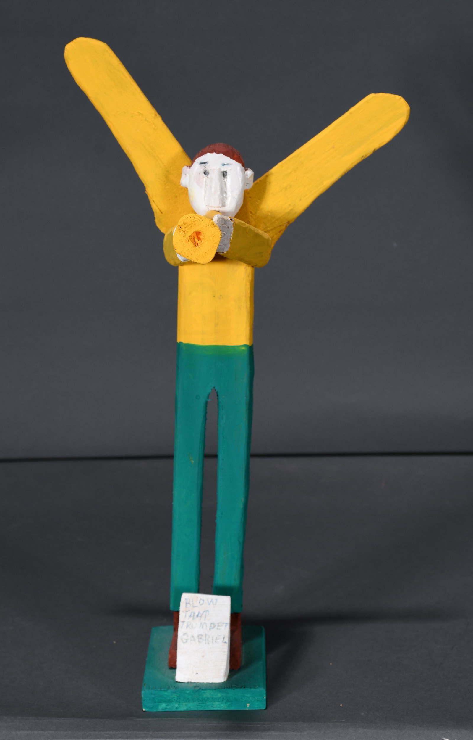 Fred Webster. Blow That Trumpet Gabriel.: Fred Webster. Blow That Trumpet Gabriel. Signed and titled. Carved and painted wood. Repair to wing, otherwise good condition. 13"h. Est. $100-200. Ship: $45