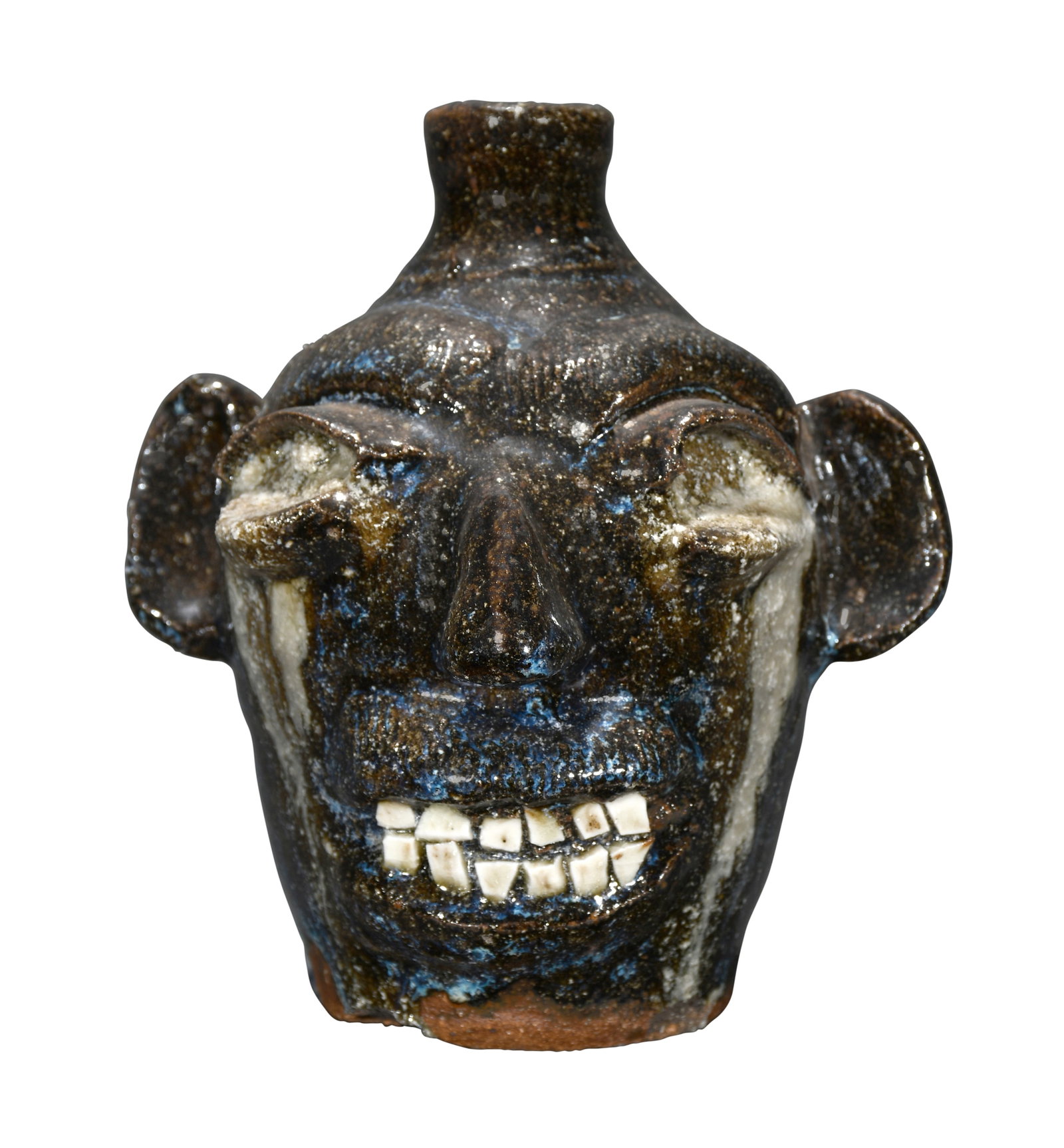 B.B. Craig. Half Pint Crying Eye Face Jug.: B.B. Craig. Half Pint Crying Eye Face Jug. Stamped. Nice rutile glaze throughout. Double row of baby teeth. Mint condition. 5.75" h. Est. $1,000-2,000. Ship: $45