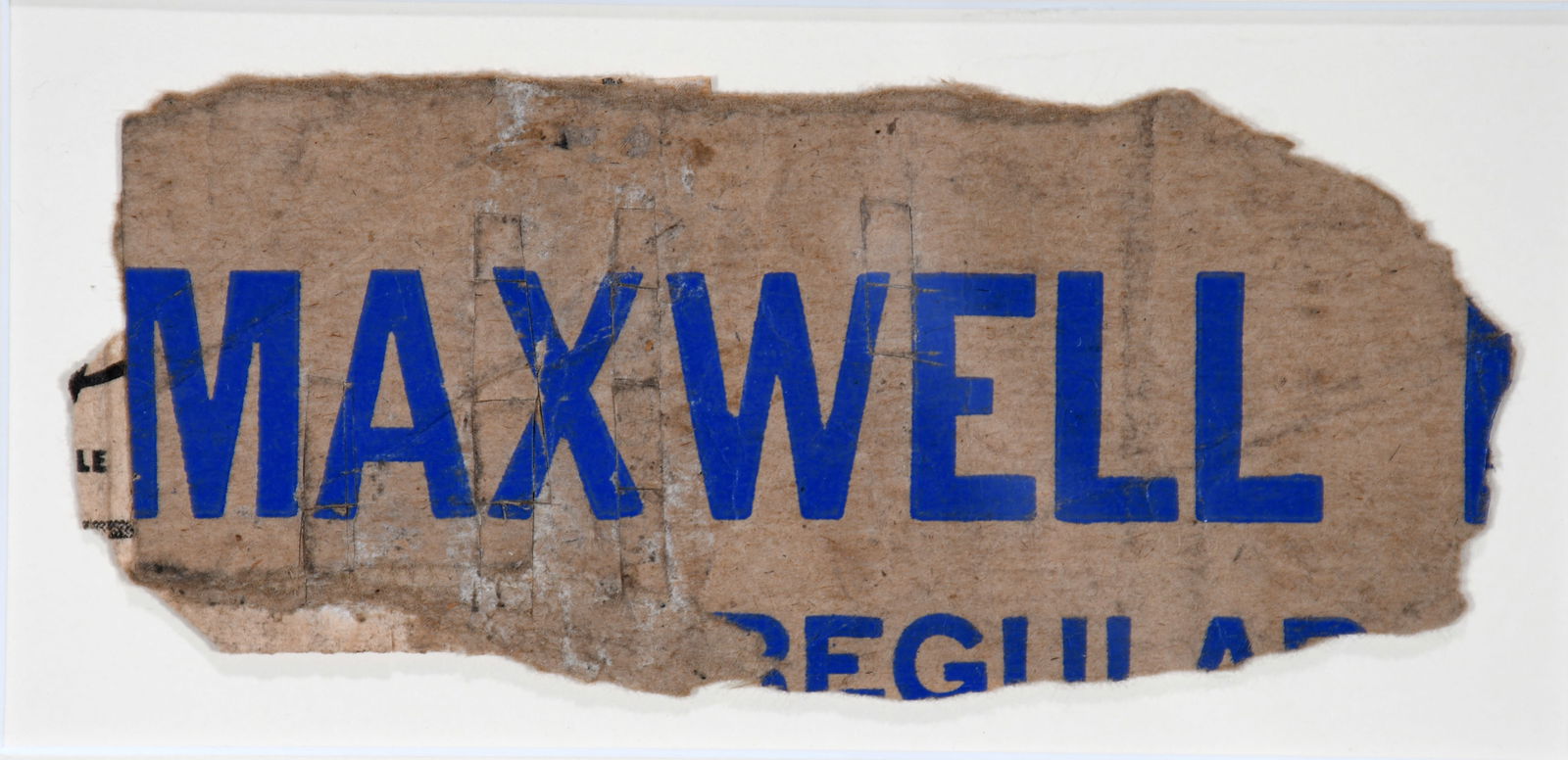 James Castle. Maxwell.: James Castle. Maxwell. Not signed. Found collaged paper and whet paste. Great found environmental condition. Image is 6" w x 2.5". Frame is 11.5" w x 8" h. Provenance: Greg Kucera Gallery. Est. $1,000