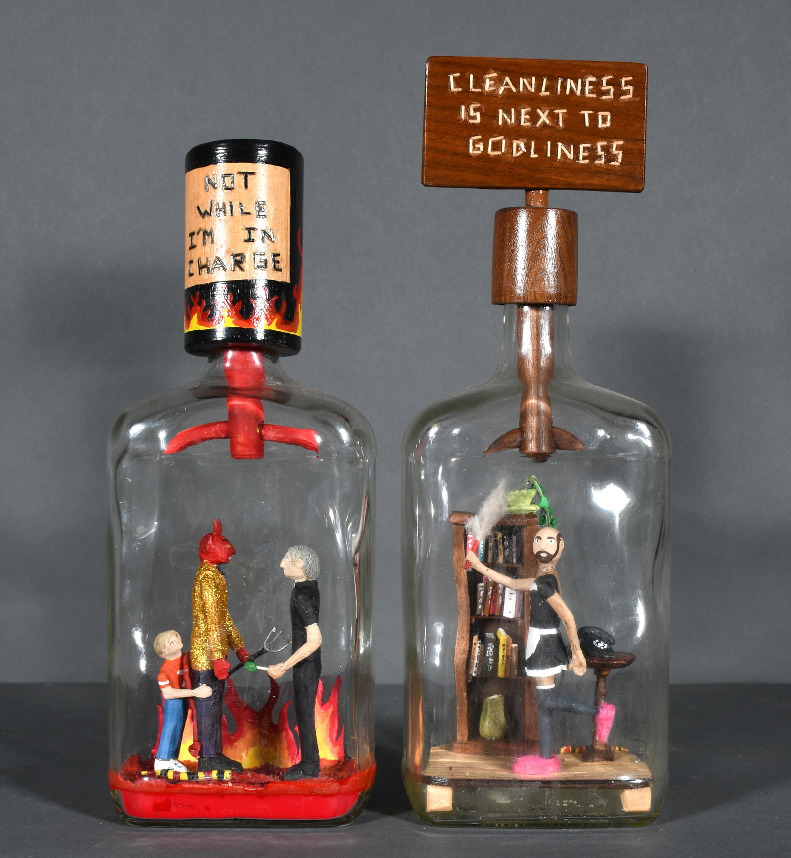 Steve Moseley. Not While I'm In Charge & Cleanliness Is Next To Godliness.: Steve Moseley. Not While I'm In Charge & Cleanliness Is Next To Godliness. 2010 and 2012. Signed and dated. Carved and painted construction inside glass bottles. Excellent condition. Largest is 15.5" 