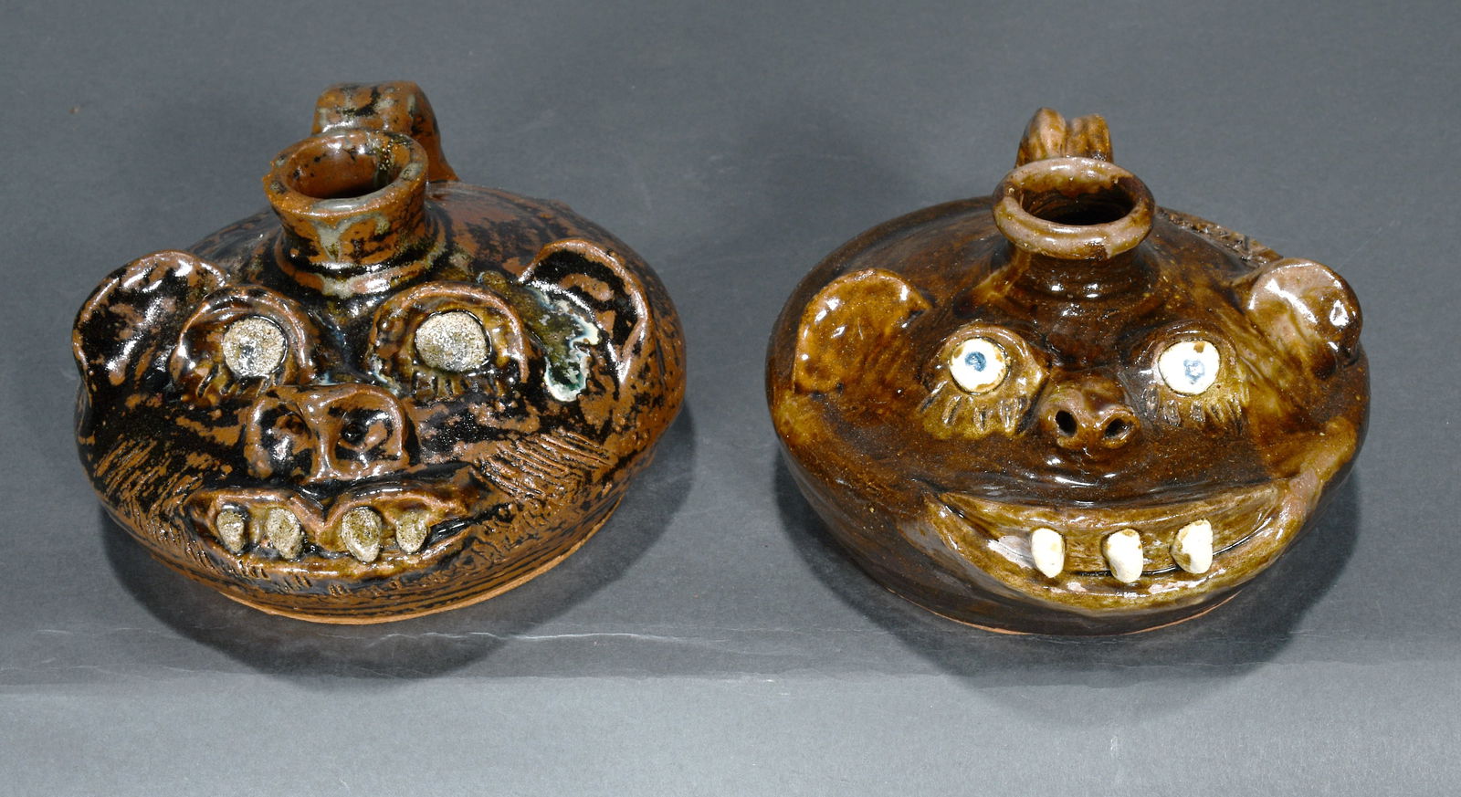 Marie Rogers.   Pair of Buggy Face Jugs. (1 of 2)