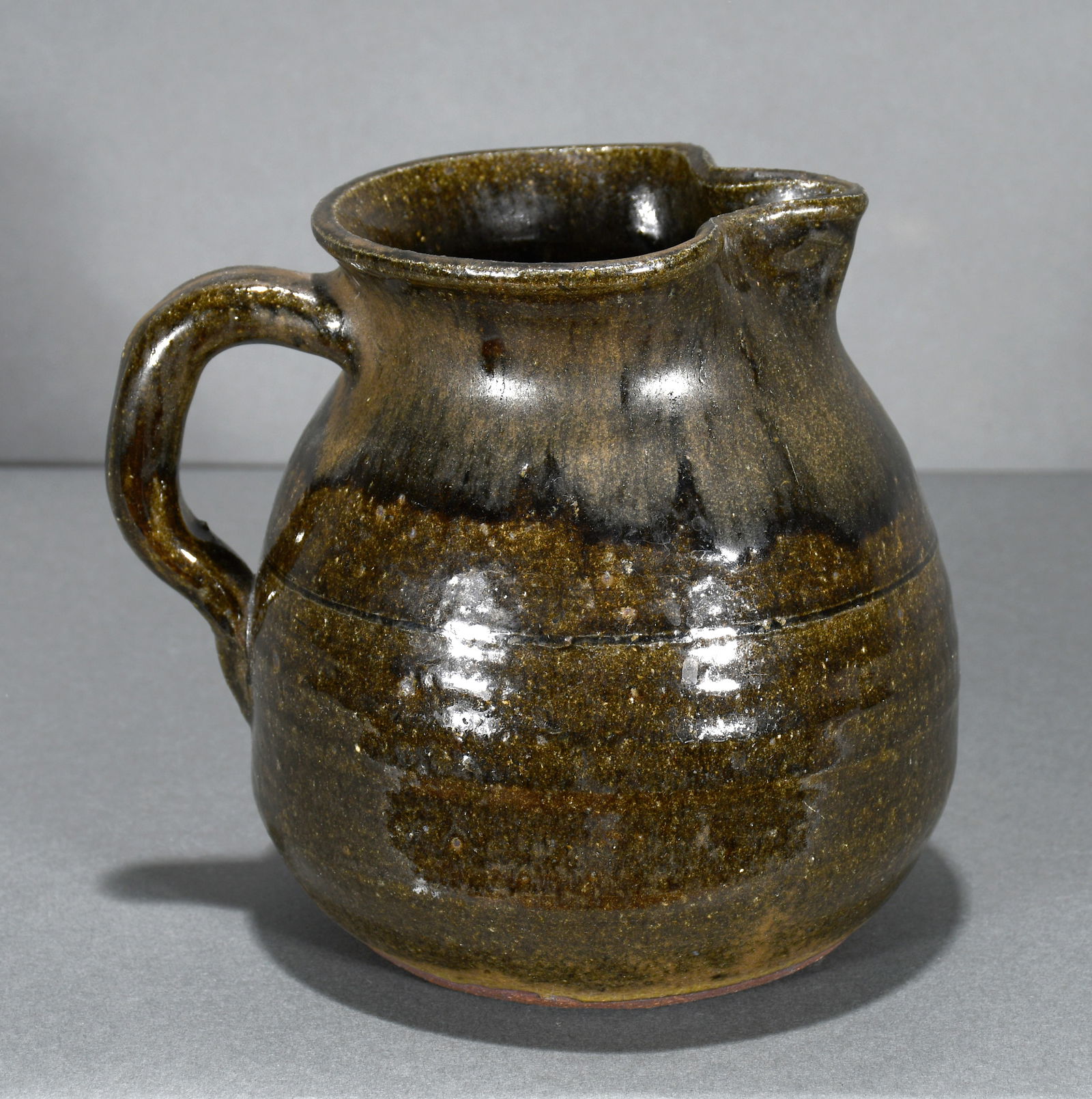 Lanier Meaders. Two Tone Glaze Large Creamer.: Lanier Meaders. Two Tone Glaze Large Creamer. c. 1970's. Signed. Mint condition. 7" h. Est. $300-500. Ship: $45