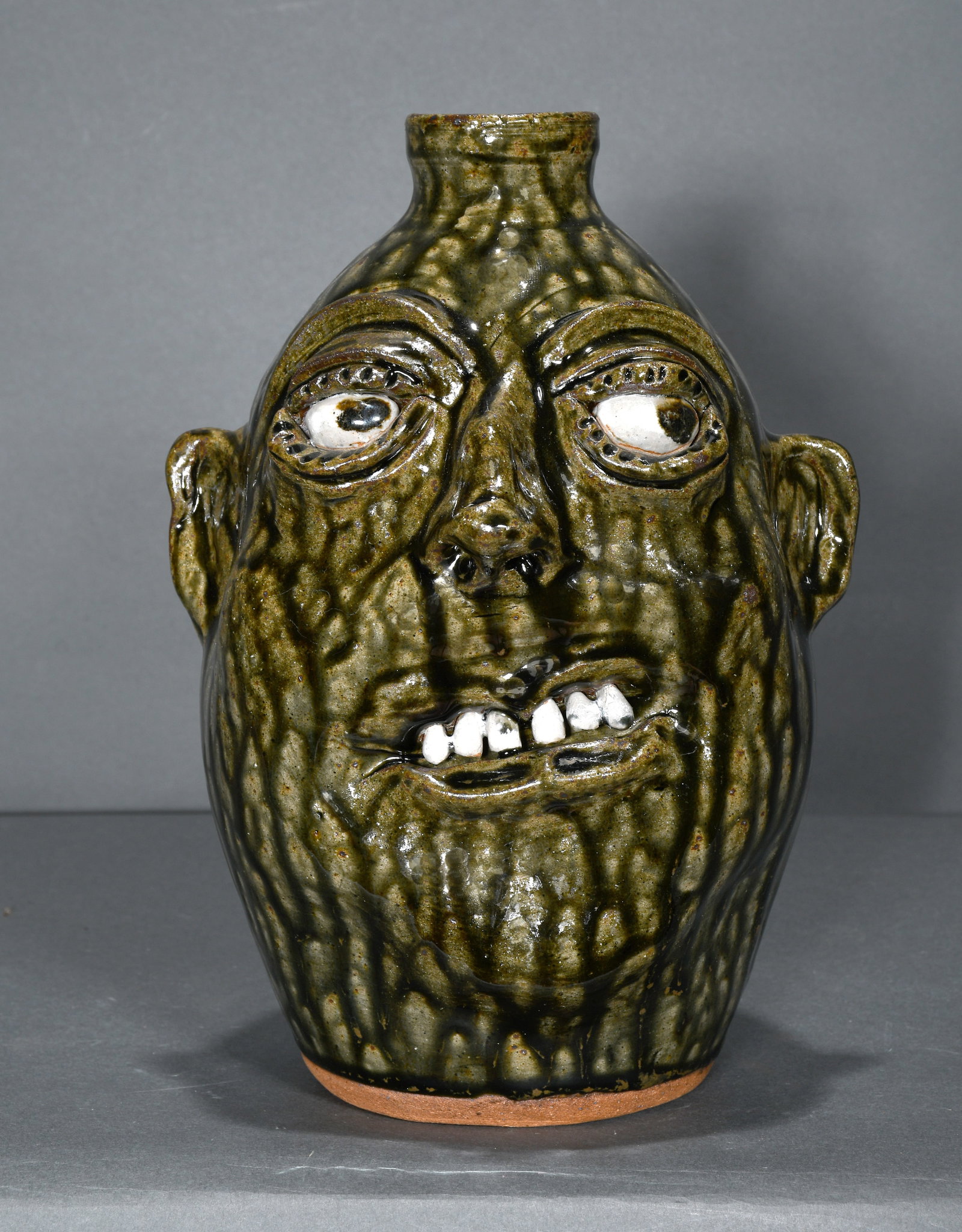 Cleater and Billie Meaders. Side Ways Looking Face Jug.: Cleater and Billie Meaders. Side Ways Looking Face Jug. 1997. Signed and dated. Mint condition. 10" h. Est. $100-300. Ship: $45
