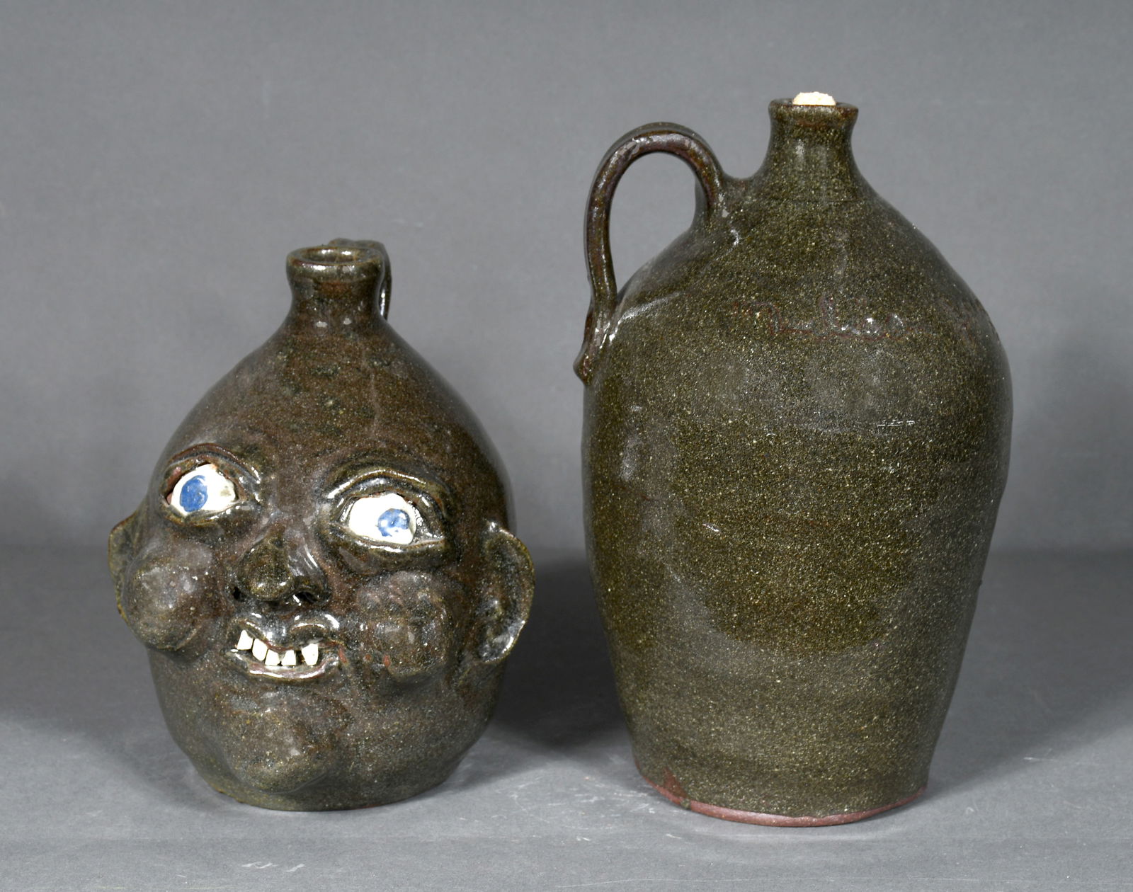 Grace Nell Hewell.  Small Face Jug and Whiskey Jug. (1 of 2)