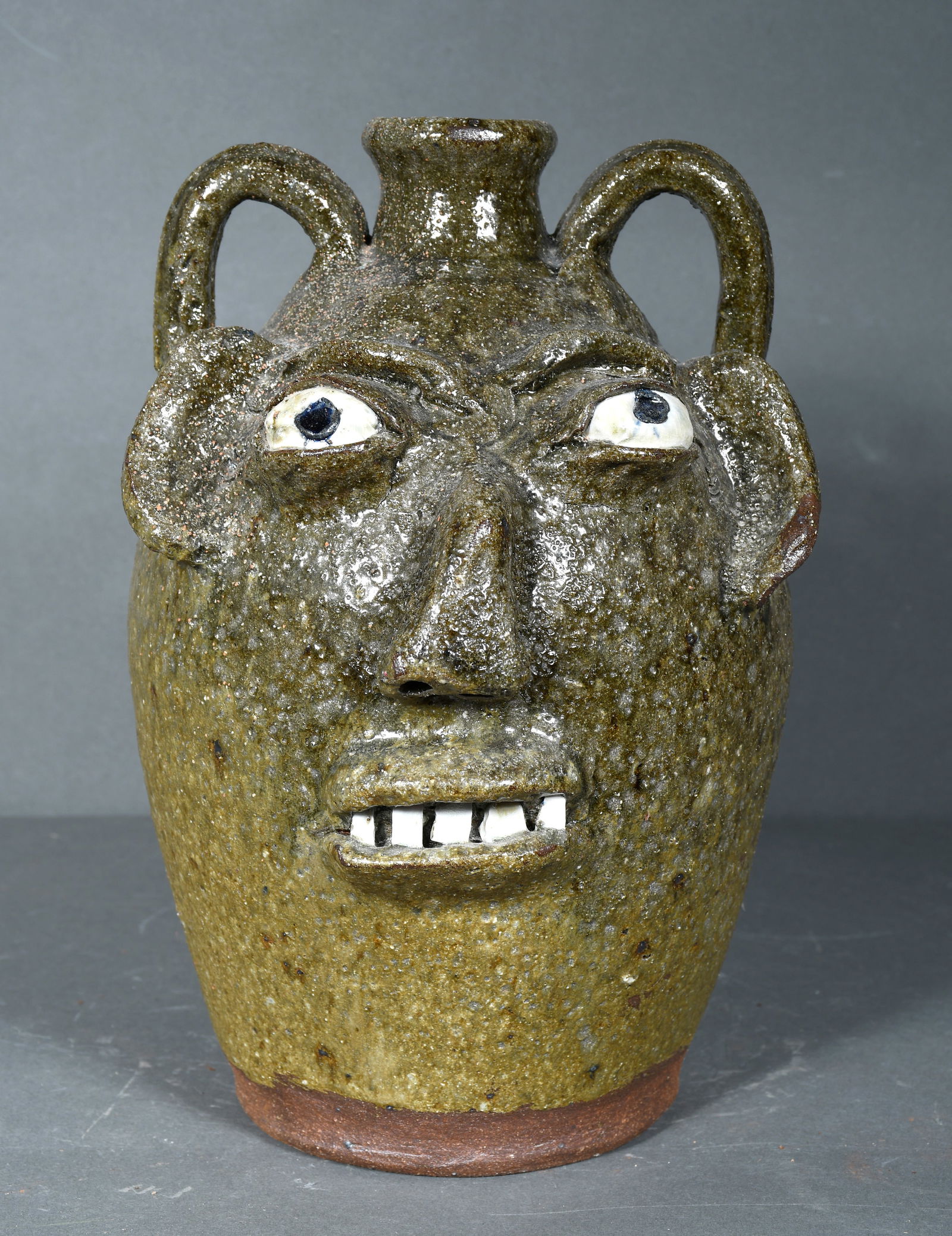 B.B. Craig.  Ash Glaze 2 Gallon Face Jug with  Rough Texture. (1 of 3)