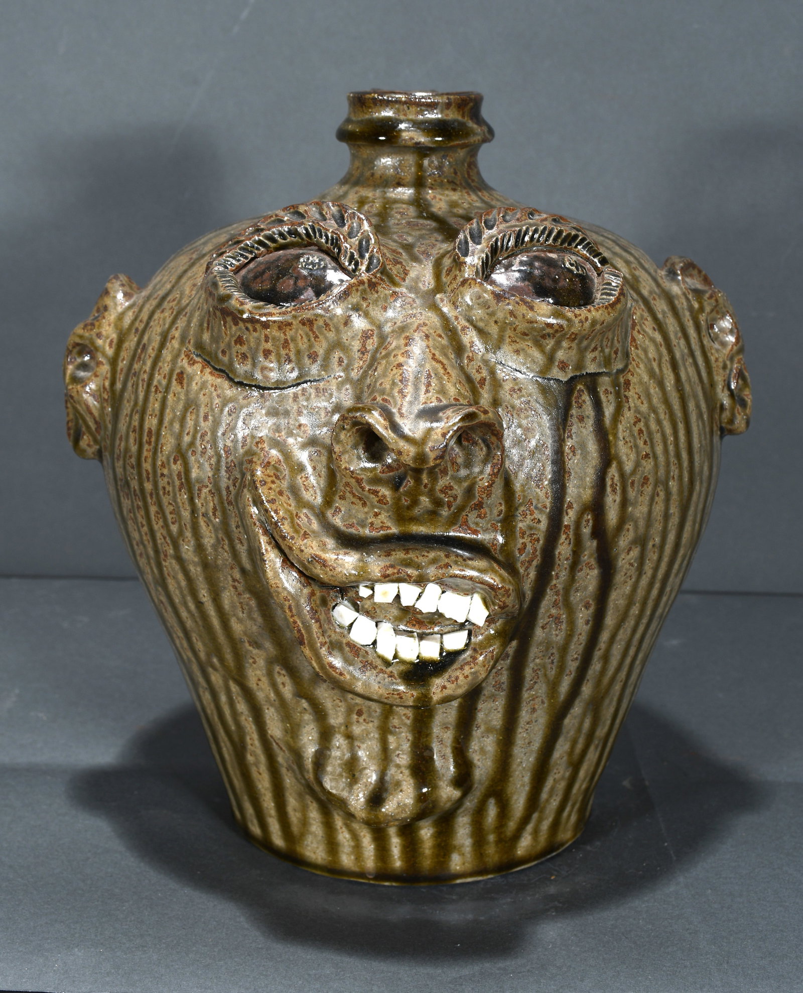 Billy Ray Hussey. May The Lord Bless and Keep Face Jug.: Billy Ray Hussey. May The Lord Bless and Keep Face Jug. 1990. Signed, dated and titled. Minor kiln shrinkage on bottom, otherwise excellent condition. 11" h. Est. $200-300. Ship: $55