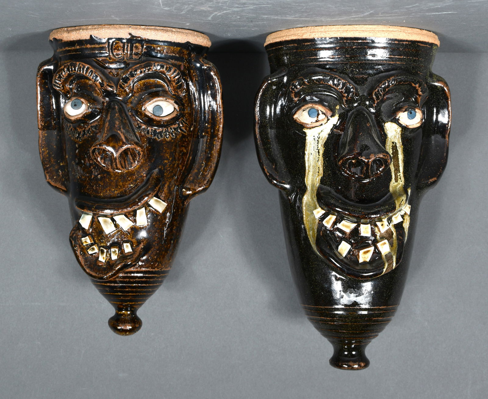Charles Lisk.  Pair of Face Wall Pockets. (1 of 2)